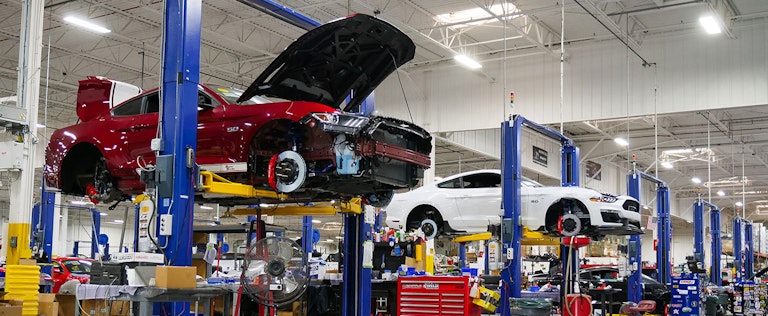 Shelby cars on lifts while in the production queue